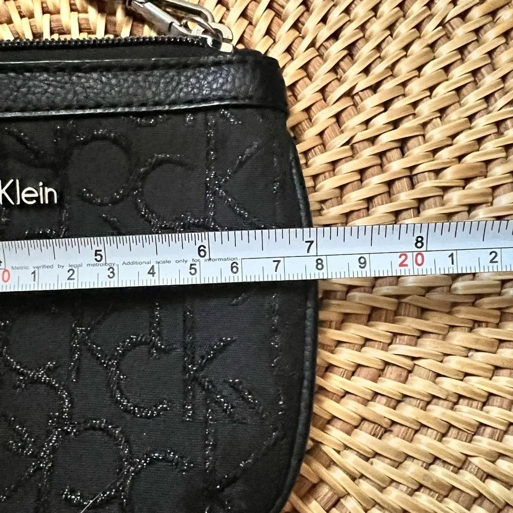 Calvin Klein black zip wristlet pouch with sparkly CK lettering